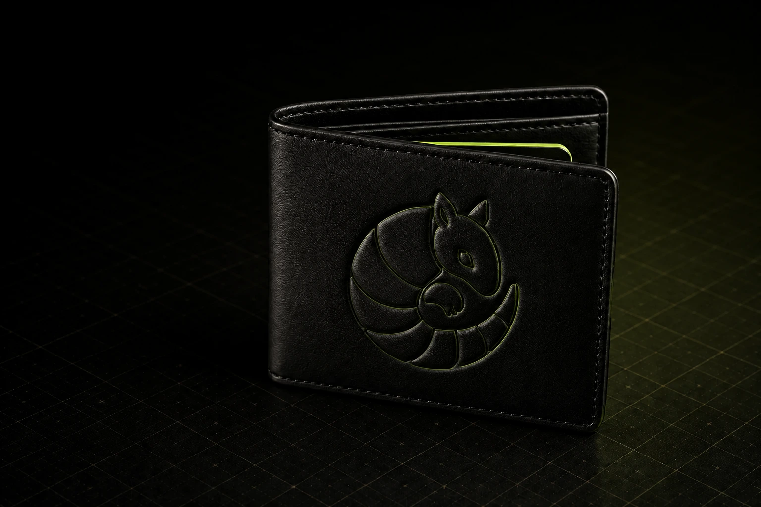 Editorial product image of a black wallet embossed with a curled armadillo and a single acid-green card edge.